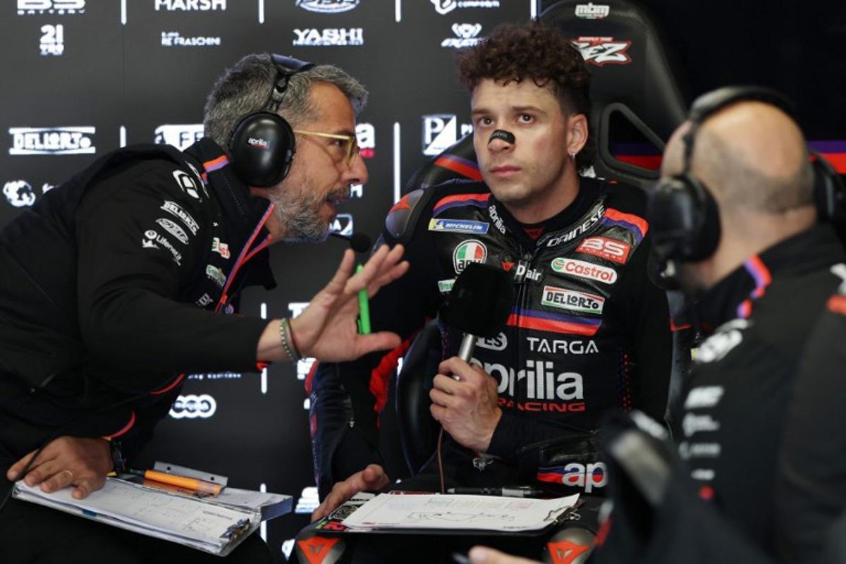 Team Aprilia Racing's Marco Bezzecchi is seen in the box during the second free practice session at the Catalunya Moto GP Grand Prix at the Catalunya racetrack in Montmelo, near Barcelona, on May 16, 2026. Lluis GENE / AFP