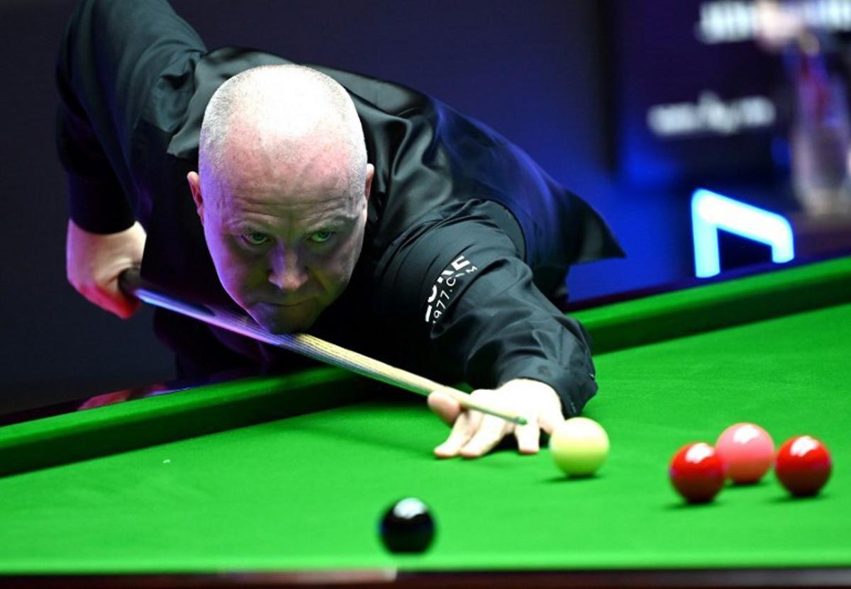 John Higgins of Scotland plays a shot during the first semi-final match against Marco Fu of Hong Kong at the Hong Kong Masters snooker tournament in Hong Kong on October 8, 2022. Peter PARKS / AFP