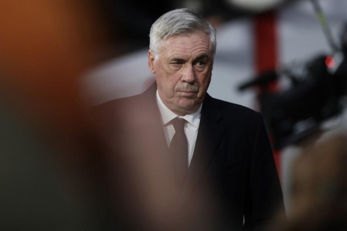 Real Madrid's Italian coach Carlo Ancelotti looks on during the UEFA Champions League Round of 16 second leg football match between Club Atletico de Madrid and Real Madrid CF at the Metropolitano stadium in Madrid on March 12, 2025. Thomas COEX / AFP