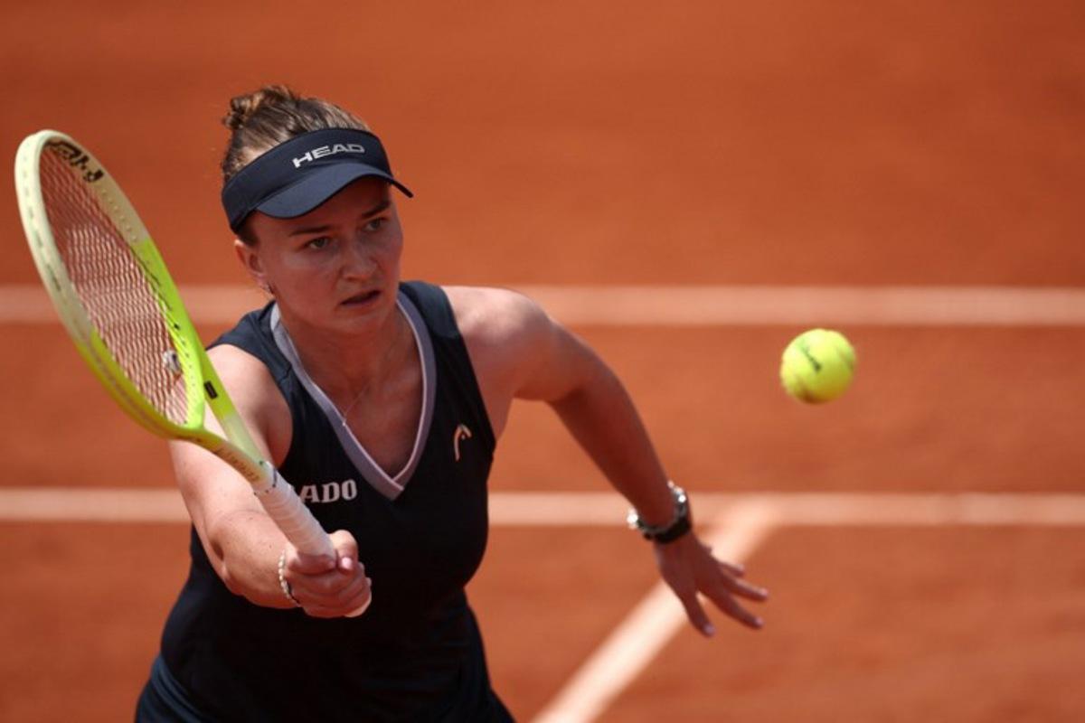Czech Republic's Barbora Krejcikova plays a backhand return to Russia's Veronika Kudermetova during their women's singles match on day 5 of the French Open tennis tournament at the Roland-Garros Complex in Paris on May 29, 2025. Anne-Christine POUJOULAT / AFP