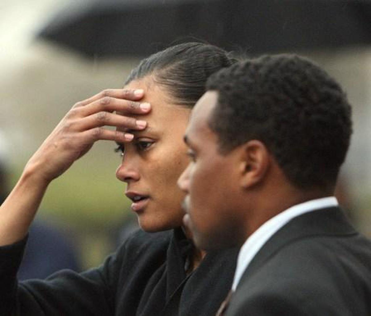 Disgraced former track star Marion Jones leaves Federal Court after sentencing 11 January 2008 in White Plains, New York, accompanied by husband Obadele Thompson (R). Jones was sentenced to six months in prison for lying about taking steroids in a doping scandal that cost the sprinter her Olympic medals. Jones had admitted she lied to federal investigators about being a dope cheat and about her role in a check fraud scheme. AFP PHOTO/DON EMMERT
