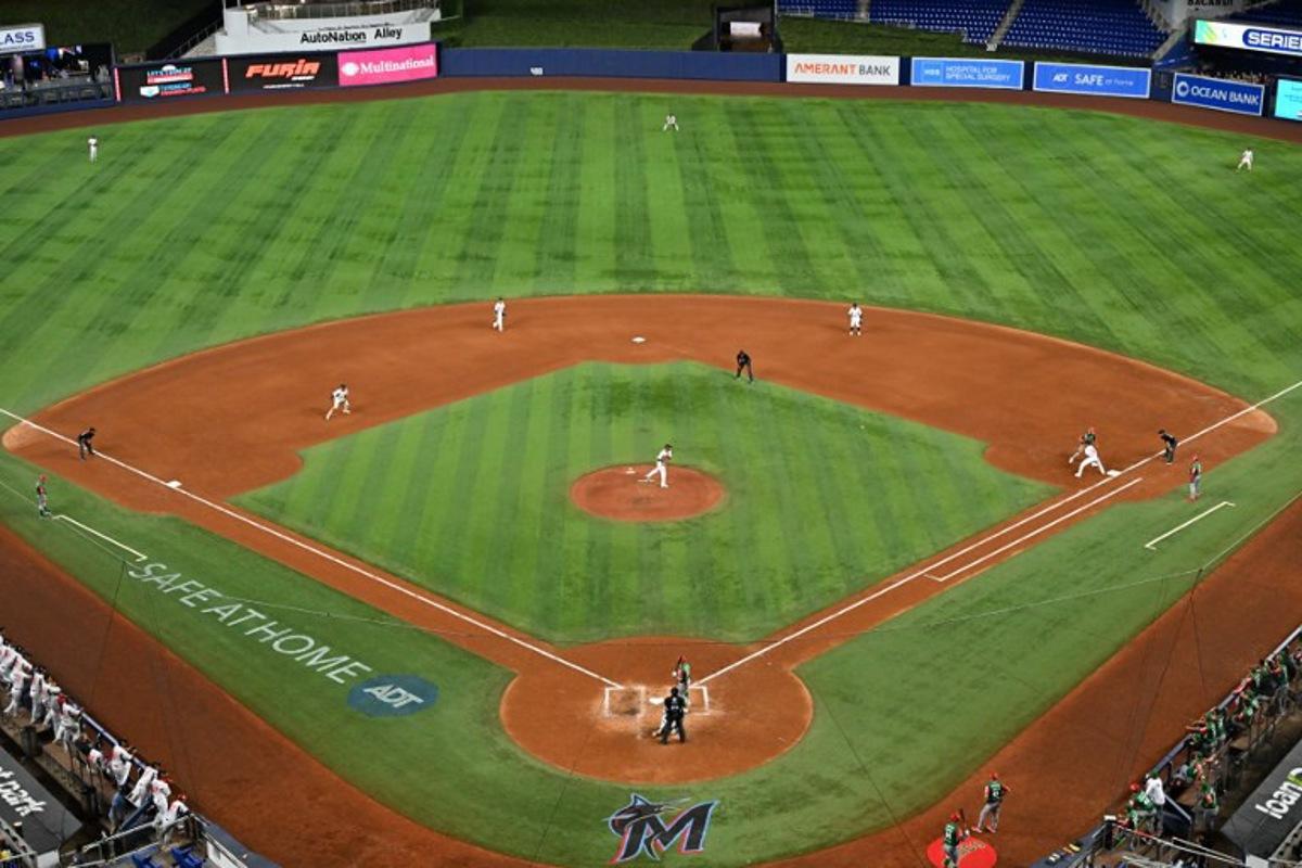 Panama's pitcher #24 Kenny Hernadez throws the ball to first base during the Caribbean Series baseball game between Mexico and Panama at LoanDepot Park in Miami, Florida, on February 3, 2024. Chandan Khanna / AFP