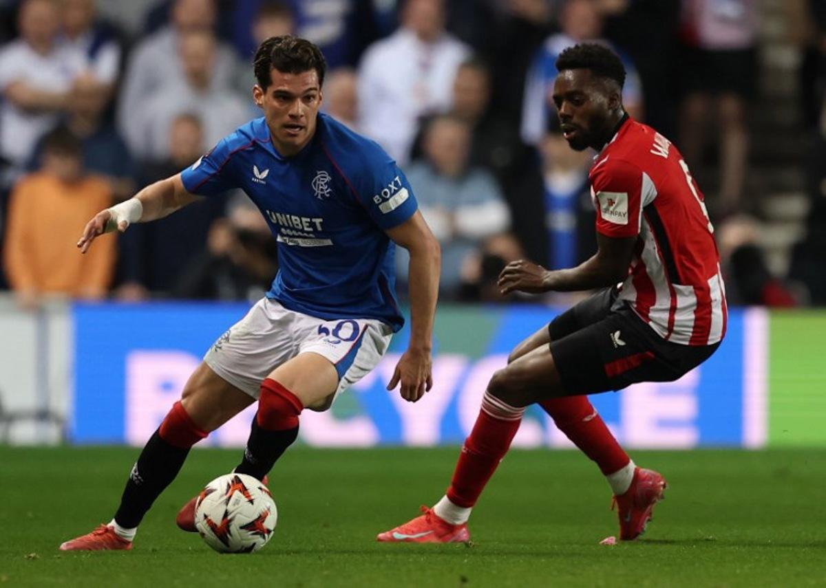 Athletic Bilbao's Spanish striker #09 Inaki Williams (R) vies with Rangers' Romanian midfielder #30 Ianis Hagi during the UEFA Europa League quarter final football match between Rangers and Athletic Club Bilbao at the Ibrox Stadium in Glasgow on April 10, 2025. Ewan Bootman / AFP