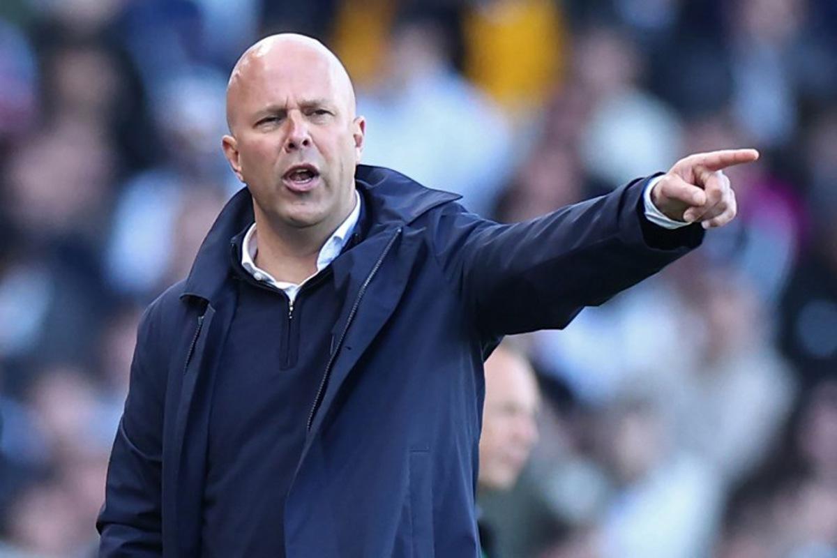 Liverpool's Dutch manager Arne Slot gestures on the touchline during the English Premier League football match between Fulham and Liverpool at Craven Cottage in London on April 6, 2025. HENRY NICHOLLS / AFP