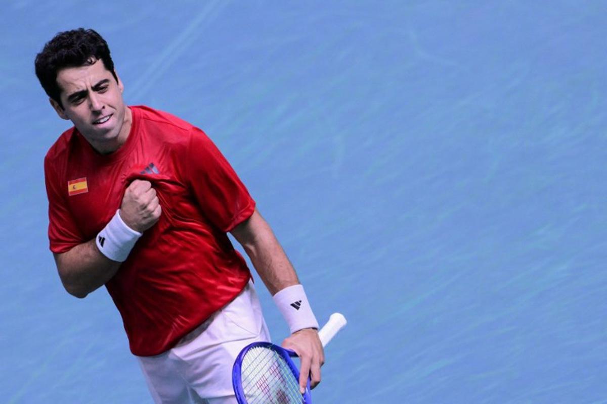 Spain's Jaume Munar Clar celebrates after winning against Czech Republic's Jiri Lehecka during the Davis Cup men's singles quarter finals tennis match, at the Super Tennis Arena, in Bologna, northen Italy, on November 20, 2025. Tiziana FABI / AFP