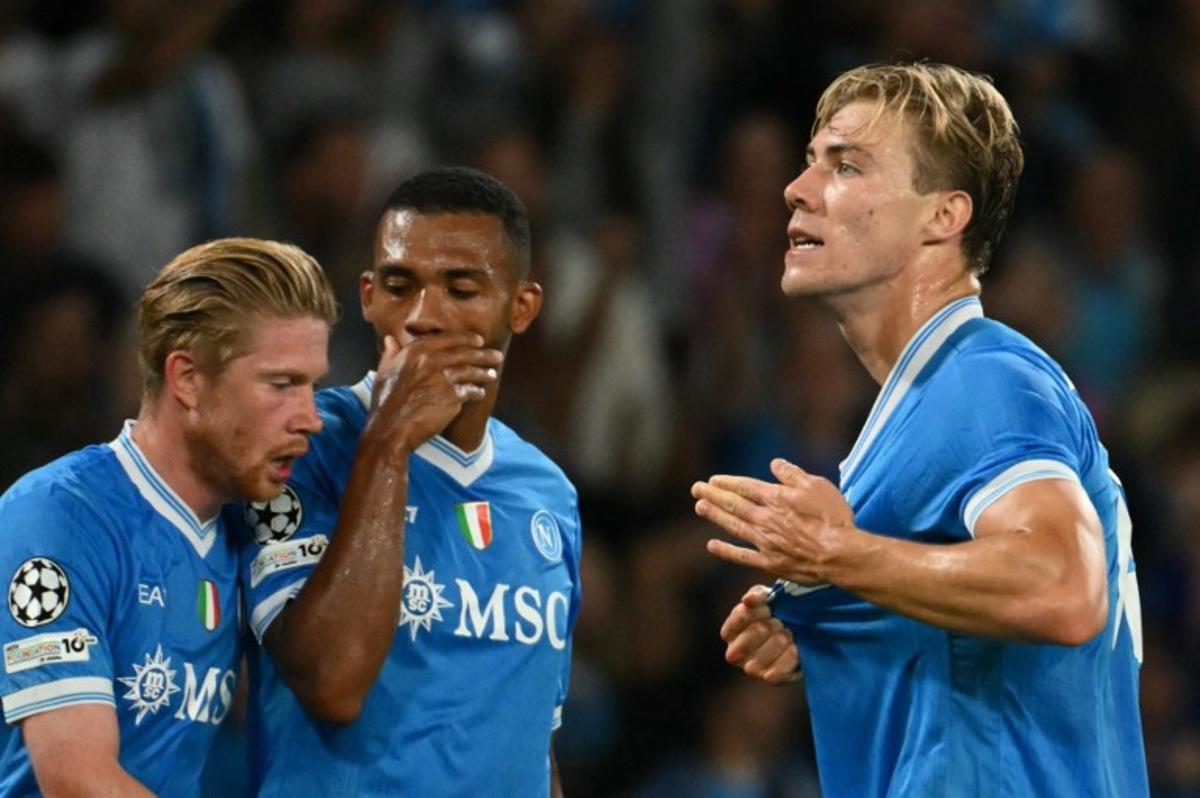 Napoli's Danish forward #19 Rasmus Hojlund celebrates scoring his team's first goal during the UEFA Champions League phase 2 football match Napoli vs Sporting Lisbon at the Diego Armando Maradona stadium in Naples on October 1, 2025. Alberto PIZZOLI / AFP