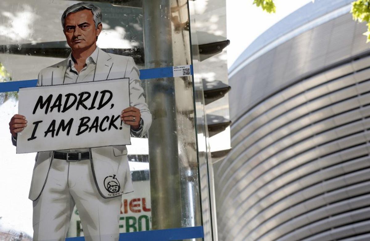 A mural by Italian urban artist Salvatore Benintende aka "TV BOY" depicting Portuguese coach Jose Mourinho is seen in front of the Santiago Bernabeu stadium in Madrid on May 21, 2026. Benfica coach Jose Mourinho confirmed on May 17, 2026 his agent Jorge Mendes has been in contact with Spanish giants Real Madrid. The veteran Portuguese coach, 63, has been strongly linked with a sensational return to the Santiago Bernabeu 13 years after he left Los Blancos. Mourinho said he personally has not had any contact with Madrid president Florentino Perez, or anyone else at the club, and that his future will be decided in the coming week. OSCAR DEL POZO / AFP