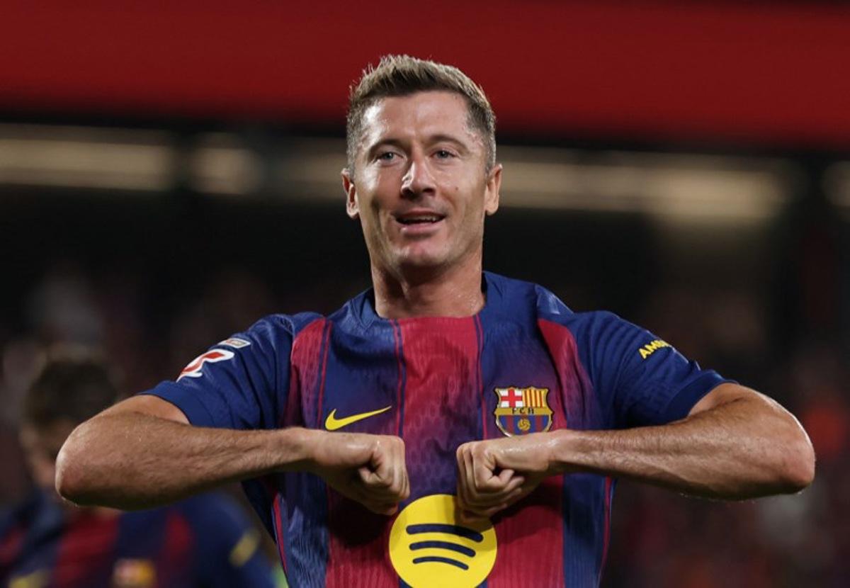 Barcelona's Polish forward #09 Robert Lewandowski celebrates scoring his team's sixth goal during the Spanish league football match between FC Barcelona and Valencia CF at Johan Cruyff Stadium in Barcelona, on September 14, 2025. Lluis GENE / AFP