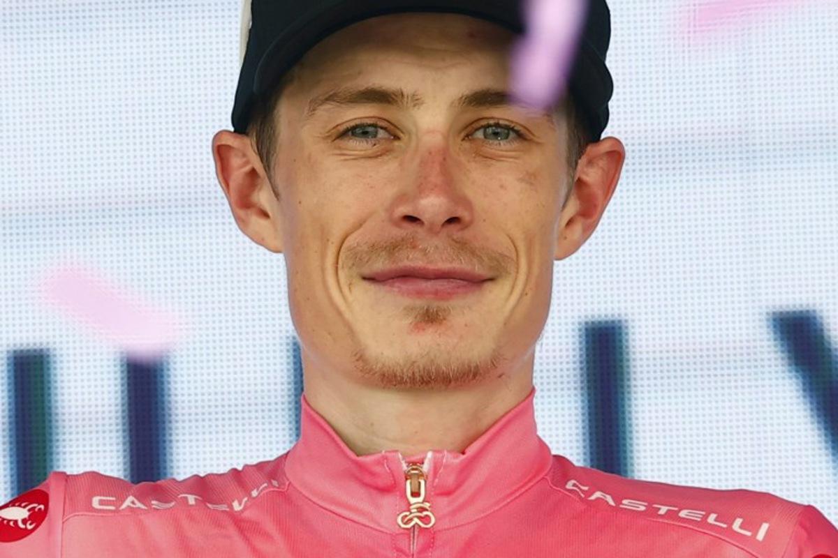 Team Visma Lease a Bike Danish rider Jonas Vingegaard celebrates the overall leader's pink jersey on the podium of the 15th stage of the Giro d'Italia 2026 - Tour of Italy cycling race between Voghera and Milan, Italy, on May 24, 2026. Luca Bettini / AFP