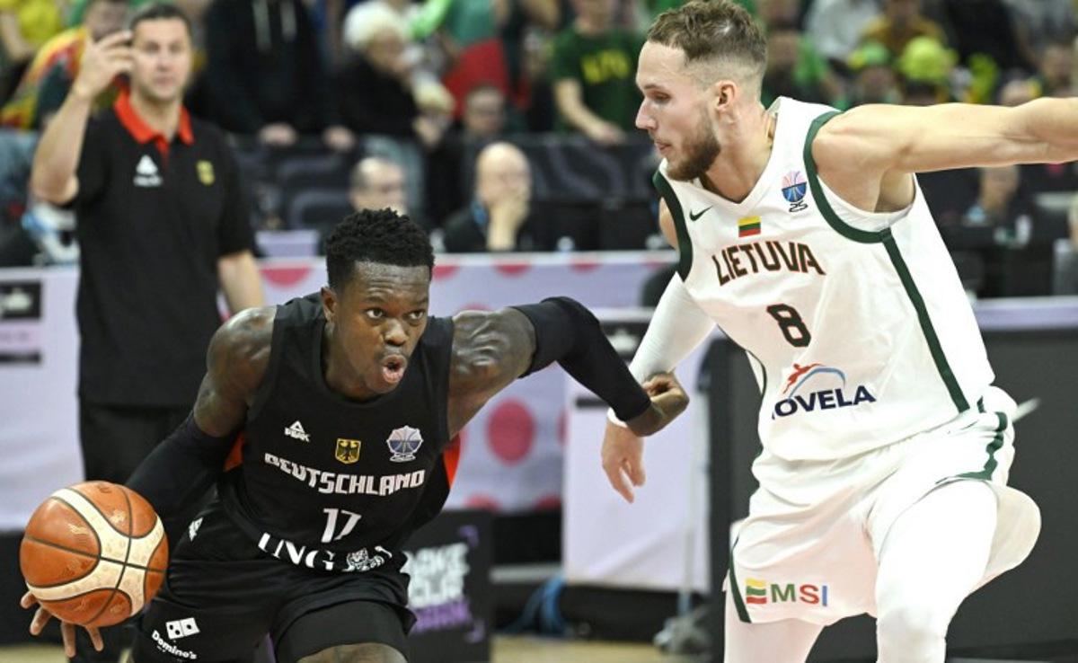 Germany's point guard #17 Dennis Schroder (L) and Lithuania's Tadas Sedekerskis vie for the ball during the basketball FIBA EuroBasket 2025 group B match between Lithuania and Germany in Tampere, Finland, on August 30, 2025. Heikki Saukkomaa / Lehtikuva / AFP