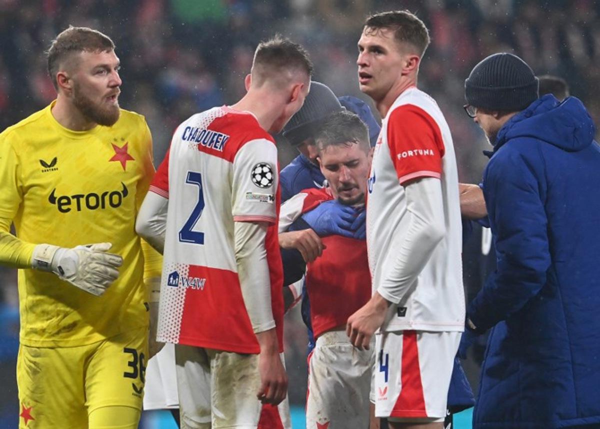 Slavia Prague's Czech midfielder #23 Michal Sadilek is helped during the UEFA Champions League league phase day 5 football match between Slavia Praha and Athletic Bilbao in Prague, on November 25, 2025. Michal Cizek / AFP