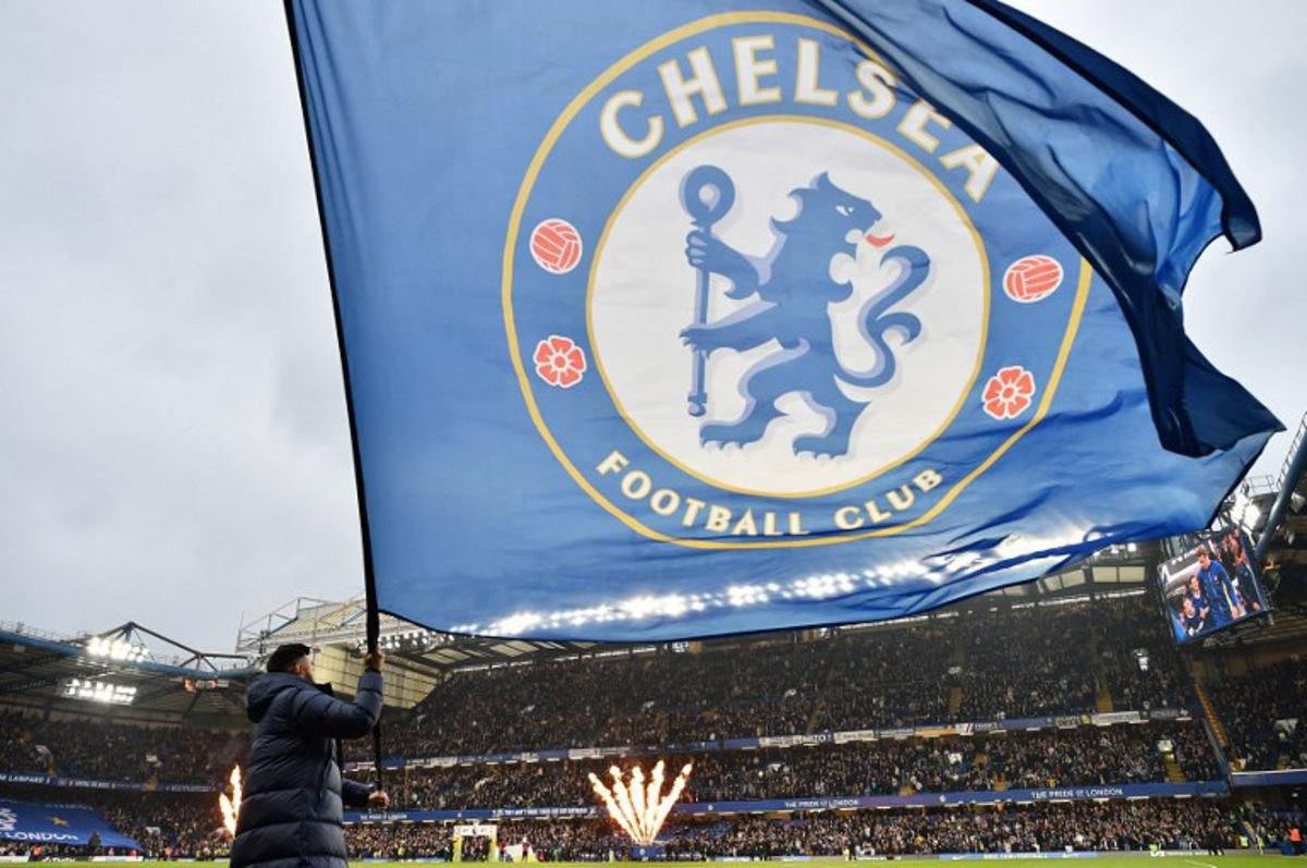Large Chelsea flags are waved ahead of kick-off in the English Premier League football match between Chelsea and Tottenham Hotspur at Stamford Bridge in London on May 2, 2024. Glyn KIRK / AFP