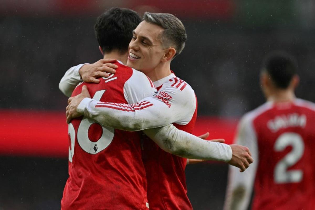 Arsenal's Spanish defender #36 Martin Zubimendi (L) celebrates with Arsenal's Belgian midfielder #19 Leandro Trossard (R) after scoring the opening goal of the English Premier League football match between Arsenal and Sunderland at the Emirates Stadium in London on February 7, 2026. Glyn KIRK / AFP
