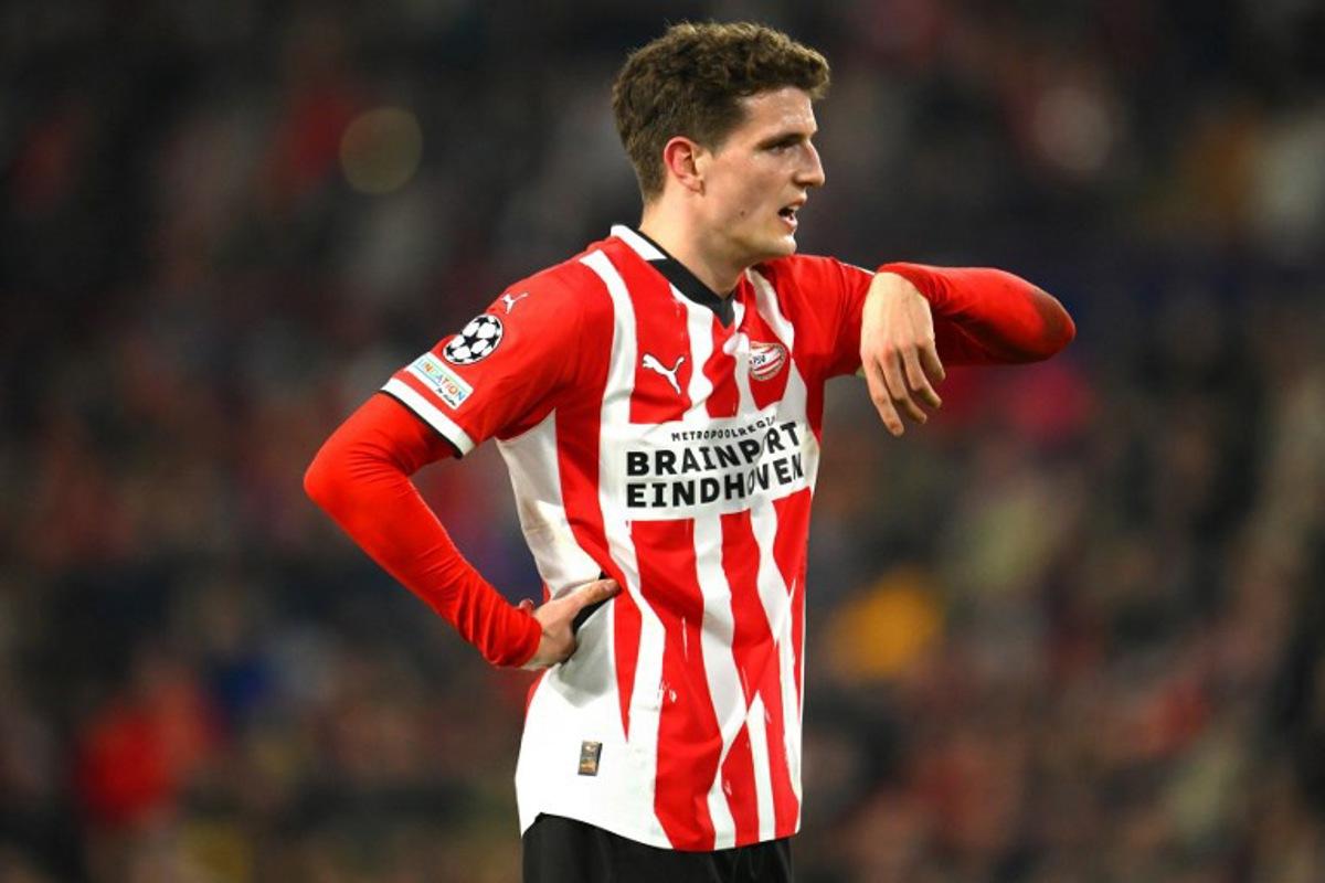 PSV Eindhoven's Dutch midfielder #20 Guus Til reacts during the UEFA Champions League round of 16 first leg football match between PSV Eindhoven (NED) and Arsenal FC (ENG) at the the PSV Stadion, in Eindhoven, on March 4, 2025. JOHN THYS / AFP