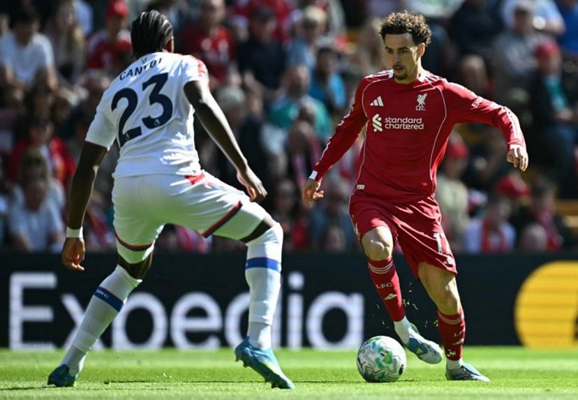 Crystal Palace's French defender #23 Jaydee Canvot (L) defends from Liverpool's English midfielder #17 Curtis Jones during the English Premier League football match between Liverpool and Crystal Palace at Anfield in Liverpool, north west England on April 25, 2026. Paul ELLIS / AFP