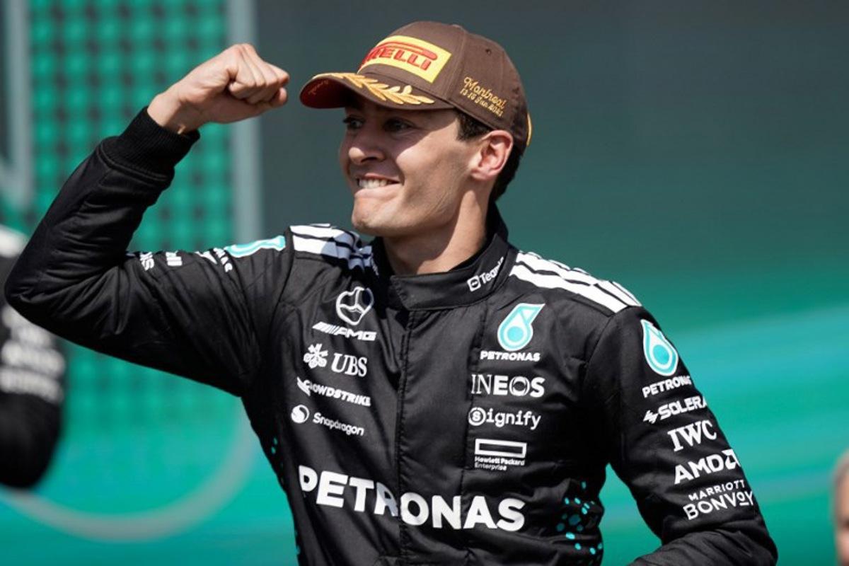 Mercedes' British driver George Russell celebrates on the podium after winning 2025 Formula 1 Grand Prix du Canada at Circuit Gilles-Villeneuve in Montreal, Canada, on June 15, 2025. Geoff Robins / AFP