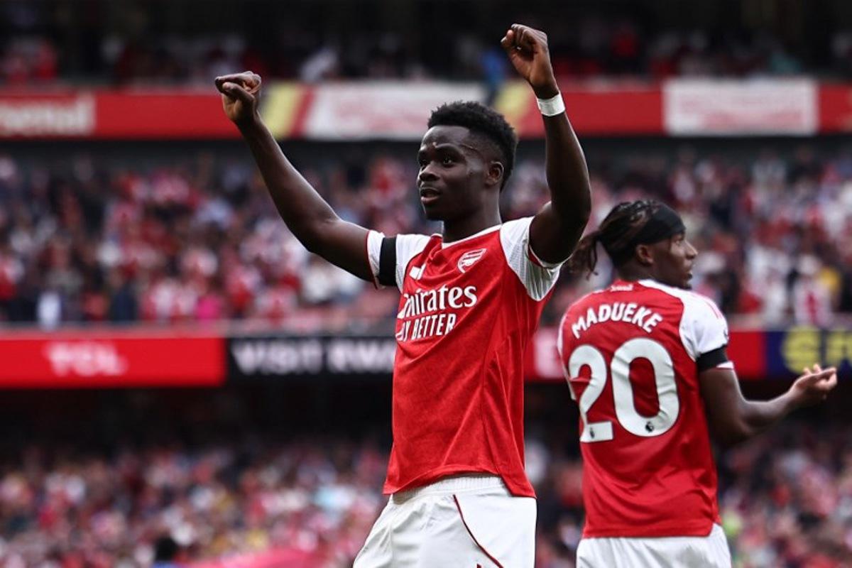 Arsenal's English midfielder #07 Bukayo Saka celebrates scoring the team's second goal during the English Premier League football match between Arsenal and Leeds United at the Emirates Stadium in London on August 23, 2025. HENRY NICHOLLS / AFP