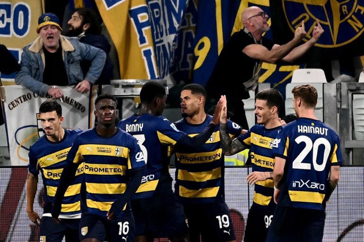 Parma's Swiss midfielder #19 Simon Sohm (C) celebrates scoring his team's second goal during the Italian Serie A football match between Juventus and Parma, at the Allianz Stadium, in Turin on October 30, 2024. Marco BERTORELLO / AFP