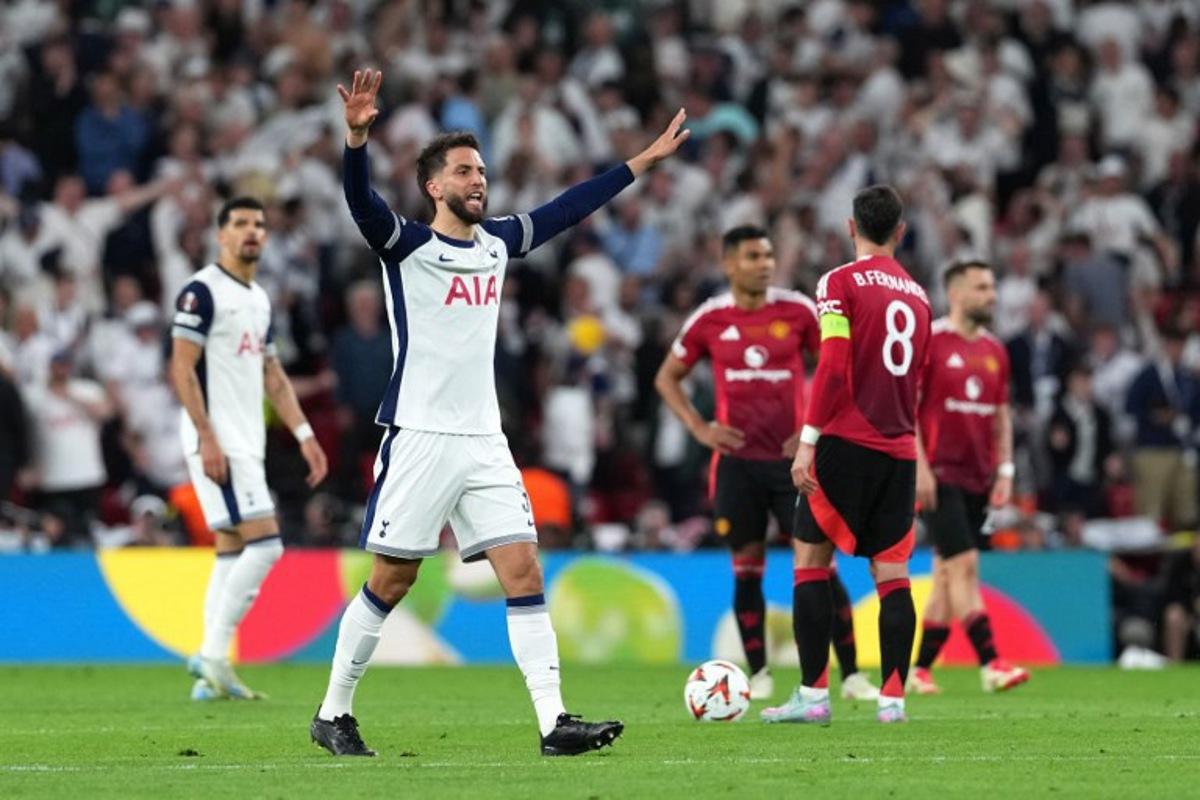 Tottenham Hotspur's Uruguayan midfielder #30 Rodrigo Bentancur celebrates the opening goal scored by Tottenham Hotspur's Welsh forward #22 Brennan Johnson during the UEFA Europa League final football match between Tottenham Hotspur and Manchester United at San Mames stadium in Bilbao on May 21, 2025. CESAR MANSO / AFP