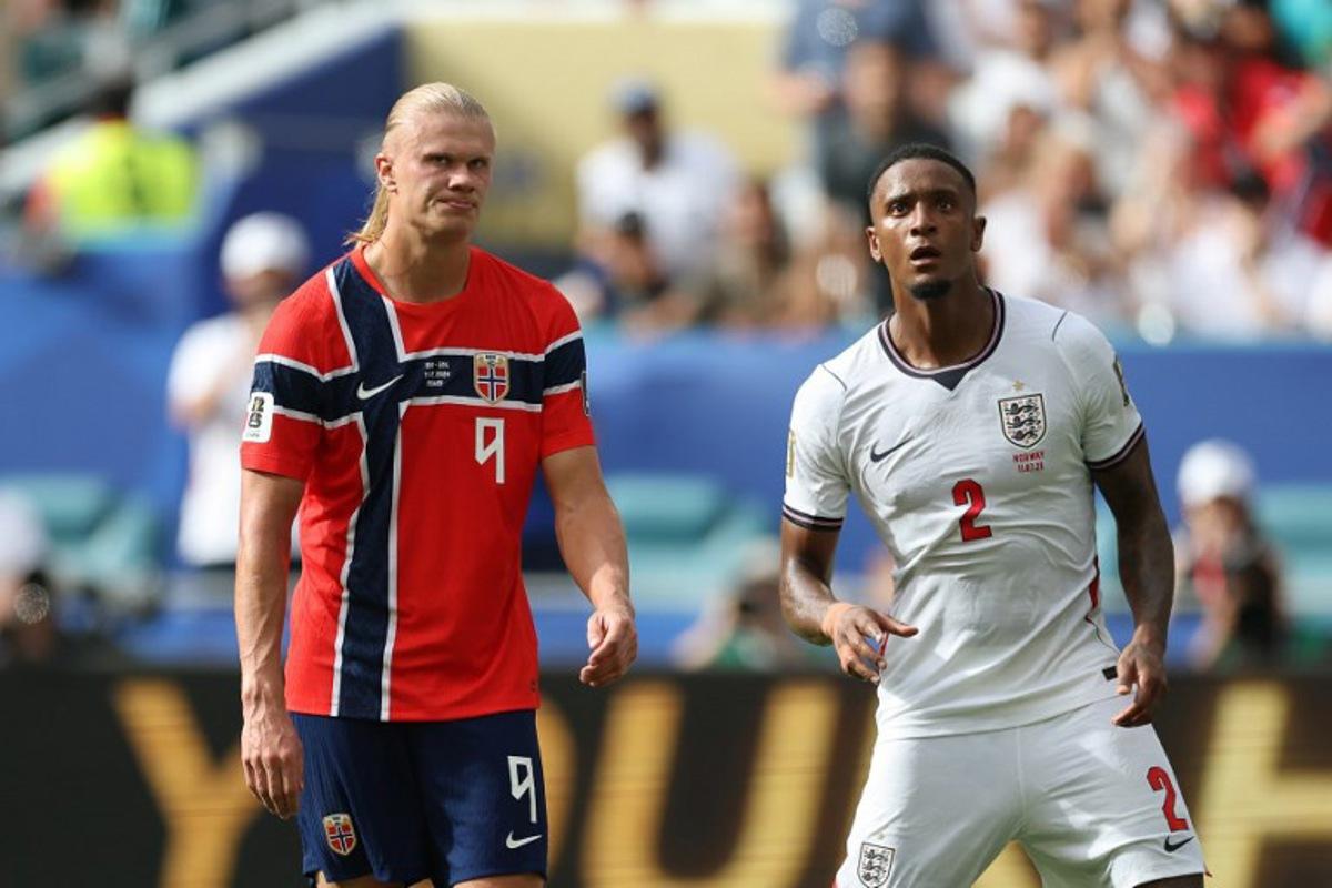 Norway's forward #09 Erling Braut Haaland reacts next to England's defender #02 Ezri Konsa during the 2026 World Cup football tournament quarter-final match between Norway and England at Miami Stadium in Miami Gardens on July 11, 2026. PATRICIA DE MELO MOREIRA / AFP