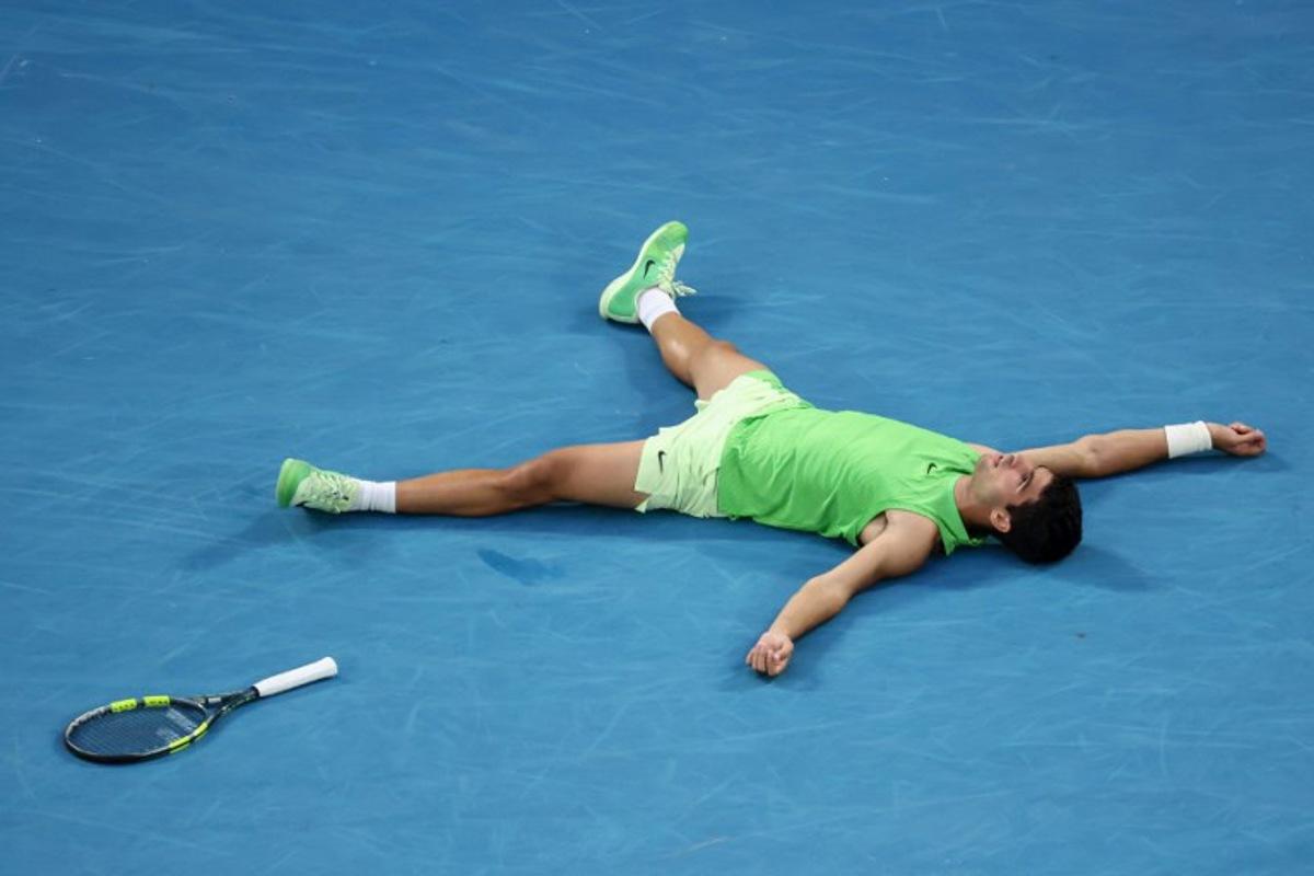 Spain's Carlos Alcaraz celebrates victory over Germany's Alexander Zverev after their men's singles semi-final match on day thirteen of the Australian Open tennis tournament in Melbourne on January 30, 2026. David GRAY / AFP