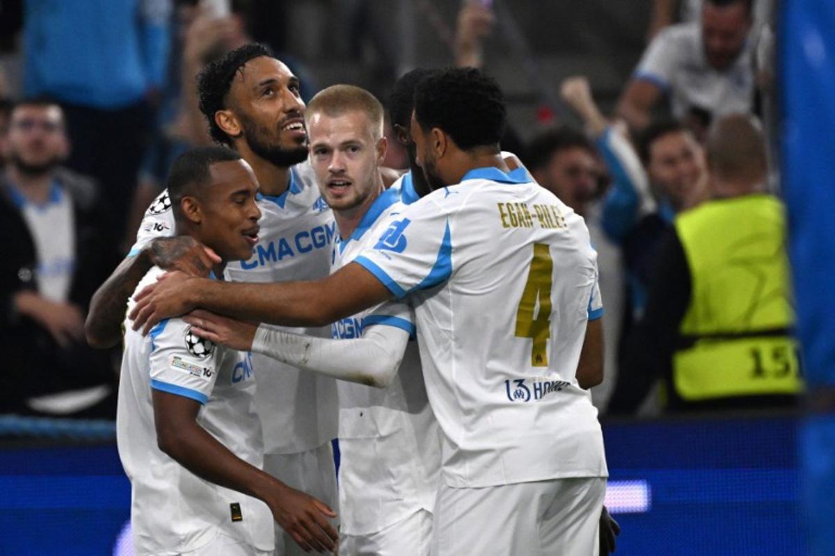 Marseille's Gabonese forward #97 Pierre-Emerick Aubameyang (2ndL) celebrates after scoring his team's fourth goal during the UEFA Champions League, league phase day 2, football match between Olympique de Marseille (FRA) and AFC Ajax (NED) at the Velodrome stadium, in Marseille on September 30, 2025. Miguel MEDINA / AFP