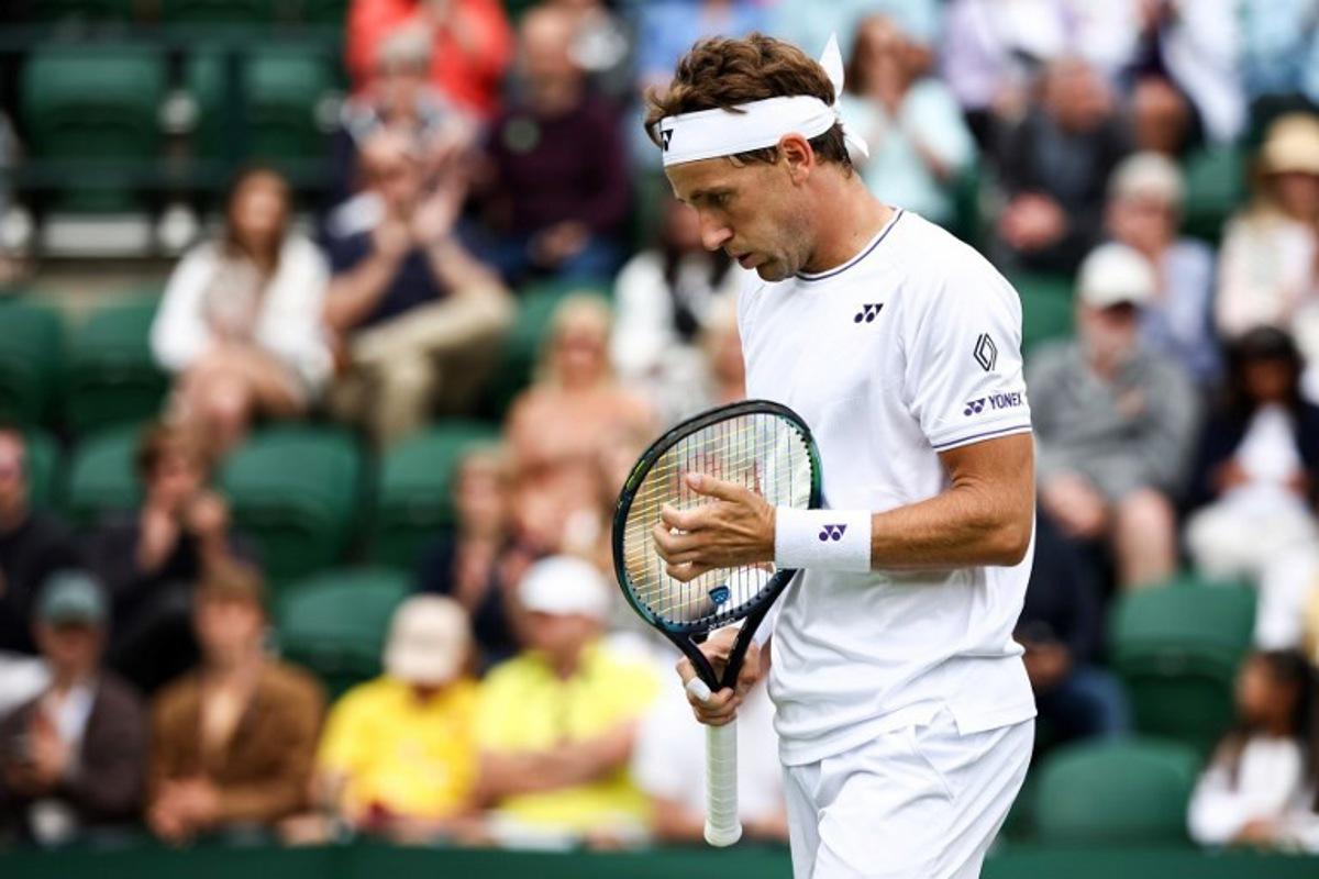 Norway's Casper Ruud reacts as he plays against Australia's Alex Bolt during their men's singles tennis match on the first day of the 2024 Wimbledon Championships at The All England Lawn Tennis and Croquet Club in Wimbledon, southwest London, on July 1, 2024. HENRY NICHOLLS / AFP