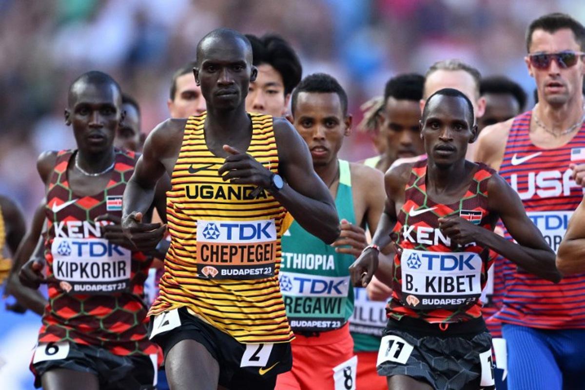 Uganda's Joshua Cheptegei, Kenya's Benard Kibet, Kenya's Nicholas Kipkorir, and other athletes compete in the men's 10,000m final during the World Athletics Championships at the National Athletics Centre in Budapest on August 20, 2023. Jewel SAMAD / AFP