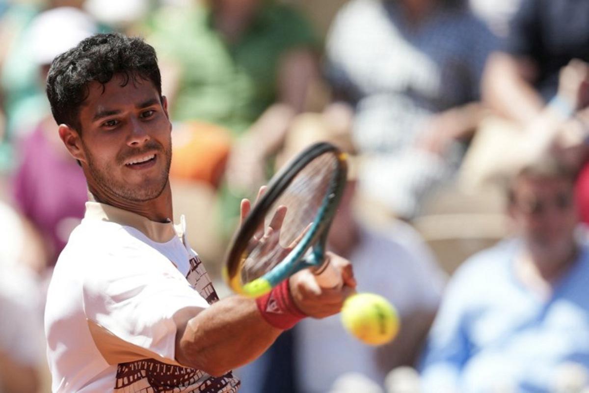 Paraguay's Adolfo Daniel Vallejo plays a forehand return to France's Moise Kouame during their men's singles match on day 5 of the French Open tennis tournament on Court Suzanne-Lenglen at the Roland-Garros Complex in Paris on May 28, 2026. Dimitar DILKOFF / AFP