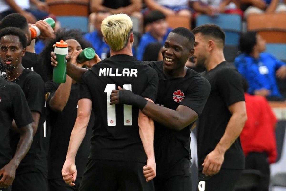 Canada's midfielder Liam Millar (C) celebrates scoring his team's fourth goal during the Concacaf 2023 Gold Cup Group D football match between Canada and Cuba at Shell Energy Stadium, Houston, Texas on July 4, 2023. Mark Felix / AFP