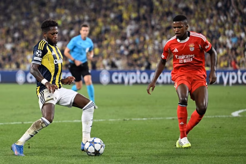 Fenerbahce's Brazilian midfielder #7 Fred (L) kicks the ball next to Benfica's Portuguese midfielder #61 Florentino (R) during the UEFA Champions League play off first leg football match between Fenerbahce (TUR) and Benfica (POR) at the Fenerbahce Sukru Saracoglu Sport Complex in Istanbul on August 20, 2025. Ozan KOSE / AFP