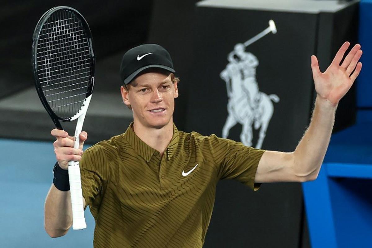 Italy's Jannik Sinner celebrates after winning against Australia's James Duckworth during their men's singles match on day five of the Australian Open tennis tournament in Melbourne on January 22, 2026. IZHAR KHAN / AFP