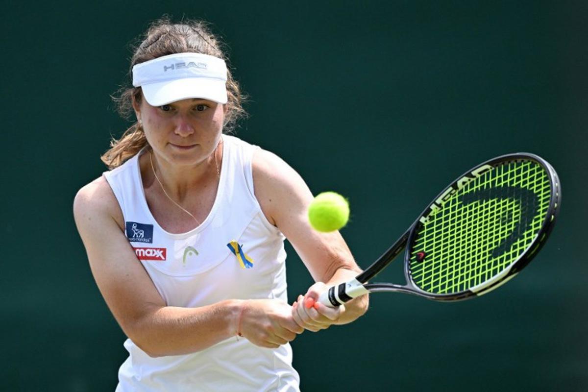 Ukraine's Daria Snigur returns to US player Ashlyn Krueger during their women's singles third round tennis match on the sixth day of the 2026 Wimbledon Championships at The All England Lawn Tennis and Croquet Club in Wimbledon, southwest London, on July 4, 2026. Kirill KUDRYAVTSEV / AFP