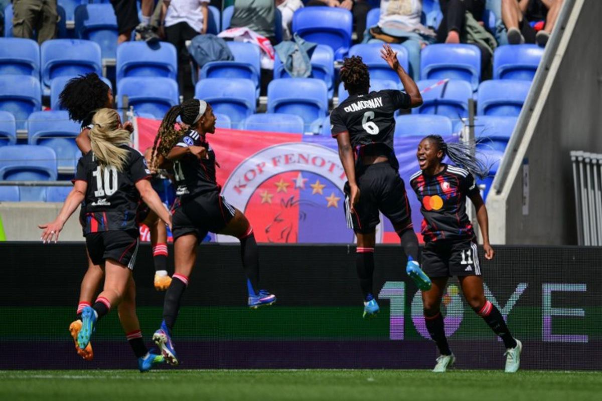 Lyonnes' players celebrate after scoring a goal during the women's UEFA Champions League second-leg semi-final football match between OL Lyonnes and Arsenal at the Groupama Stadium, in Decines-Charpieu, central-eastern France on May 2, 2026. OLIVIER CHASSIGNOLE / AFP