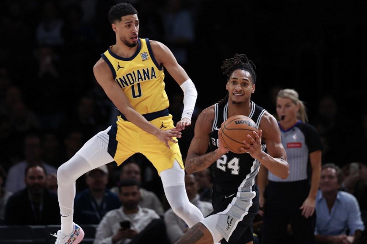 Indian Pacer's US Guard #0 Tyrese Haliburton (L) vies for the ball with San Antonio Spurs' US guard-forward #24 Devin Vassell (R) during the NBA basketball game between the Indiana Pacers and the San Antonio Spurs at the Accor Arena - Palais Omnisports de Paris-Bercy - in Paris on January 23, 2025. FRANCK FIFE / AFP