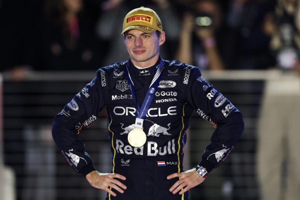 Race winner Red Bull Racing's Dutch driver Max Verstappen stands on the podium after the Las Vegas Formula One Grand Prix at the Las Vegas Strip Circuit in Las Vegas, Nevada, on November 22, 2025. Patrick T. Fallon / AFP