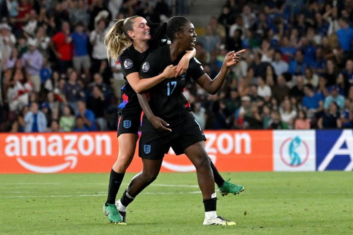 England's forward #17 Michelle Agyemang (R) celebrates with England's midfielder #10 Ella Toone (L) after scoring a goal during the UEFA Women's Euro 2025 semi-final football match between England and Italy at the Stade de Geneve in Geneva, on July 22, 2025. Miguel MEDINA / AFP