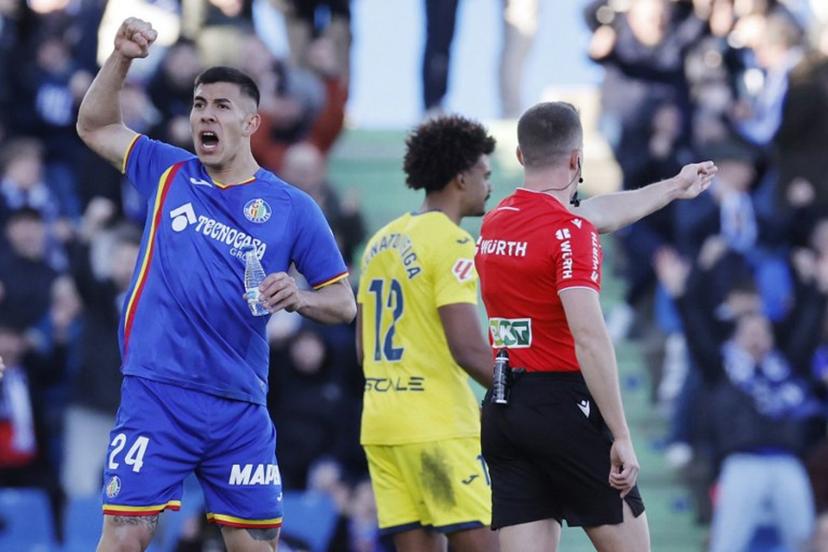 Getafe's Argentine defender #24 Zaid Romero Player celebrates as referee awards penalty against Villarrea during the Spanish league football match between Getafe CF and Villarreal CF at Coliseum Alfonso Perez Stadium in Getafe on February 14, 2026. Oscar DEL POZO / AFP