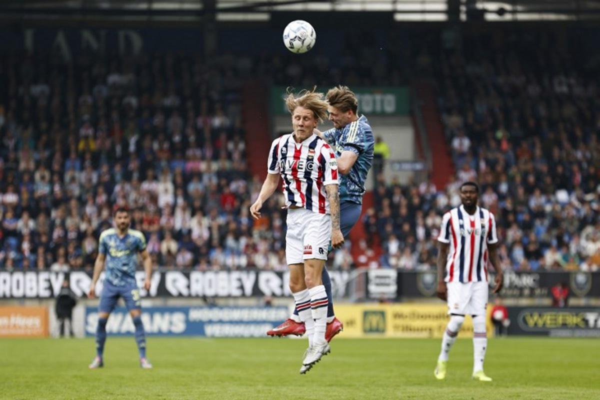 Willem II's Dutch midfielder #08 Jesse Bosch (L) fights for the ball with Ajax's Dutch midfielder #08 Kenneth Taylor during the Dutch Eredivisie football match between Willem II Tilburg and AFC Ajax Amsterdam at Koning Willem II Stadium in Tilburg on April 13, 2025. MAURICE VAN STEEN / ANP / AFP