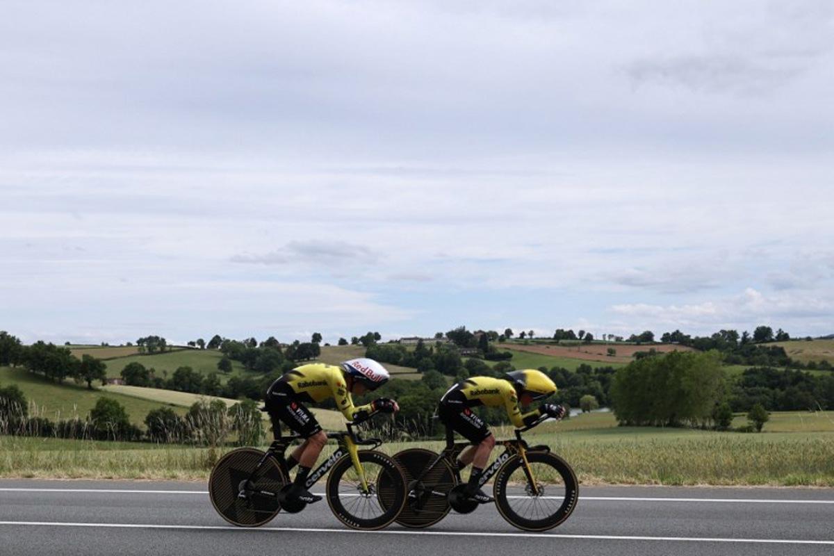 Team Visma | Lease a Bike's Belgian rider Wout Van Aert (L) cycles during the 3rd stage of the Tour Auvergne-Rhone-Alpes cycling race (formerly known as the Criterium du Dauphine), 28,4km team time trial departing and arriving in Perreux central France, on June 9, 2026. Anne-Christine POUJOULAT / AFP