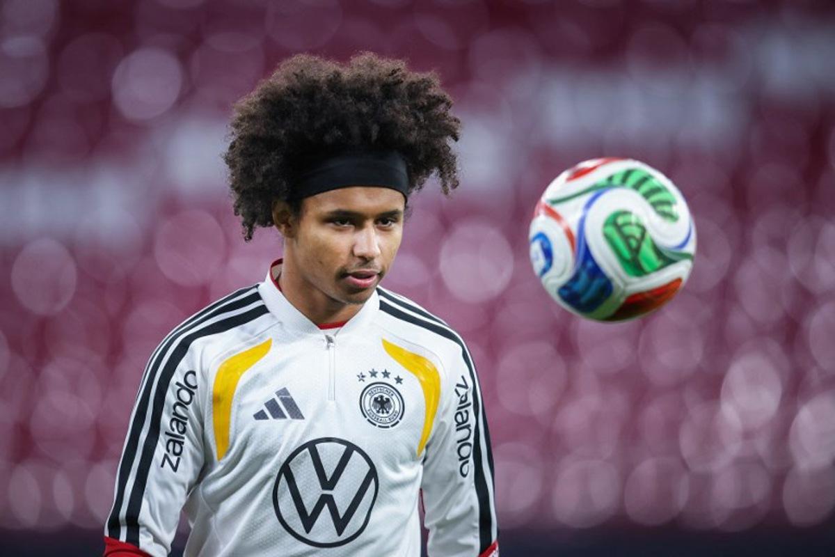 Germany's midfielder #14 Karim Adeyemi takes part in a training session in Leipzig, eastern Germany on November 16, 2025, on the eve of the FIFA World Cup 2026 European qualification Group A football match between Germany and Slovakia. RONNY HARTMANN / AFP