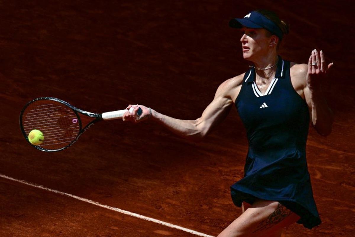 Ukraine's Elina Svitolina plays a forehand return to Germany's Tamara Korpatsch during their women's singles match on day 6 of the French Open tennis tournament on Court Suzanne-Lenglen at the Roland-Garros Complex in Paris on May 29, 2026. JULIEN DE ROSA / AFP