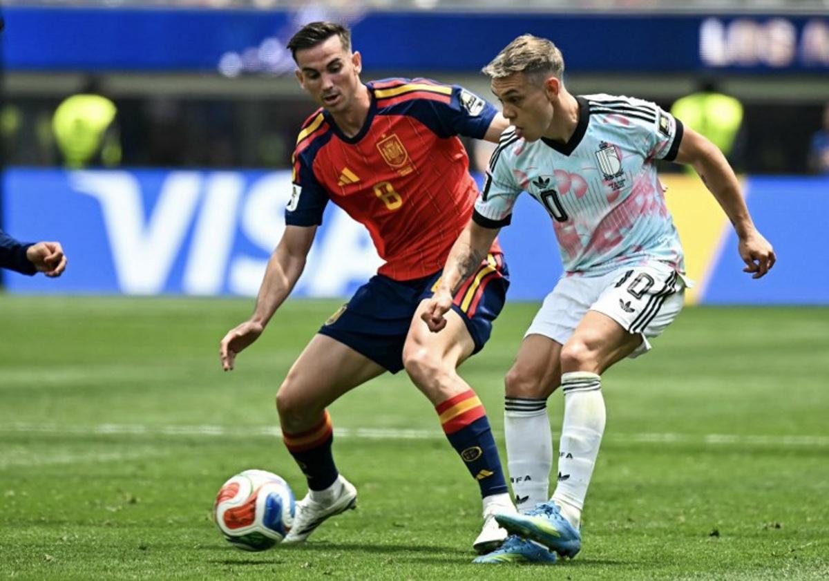 Spain's midfielder #08 Fabian Ruiz and Belgium's forward #10 Leandro Trossard fight for the ball during the 2026 World Cup football tournament quarter-final match between Spain and Belgium at the Los Angeles Stadium in Inglewood on July 10, 2026. Paul ELLIS / AFP