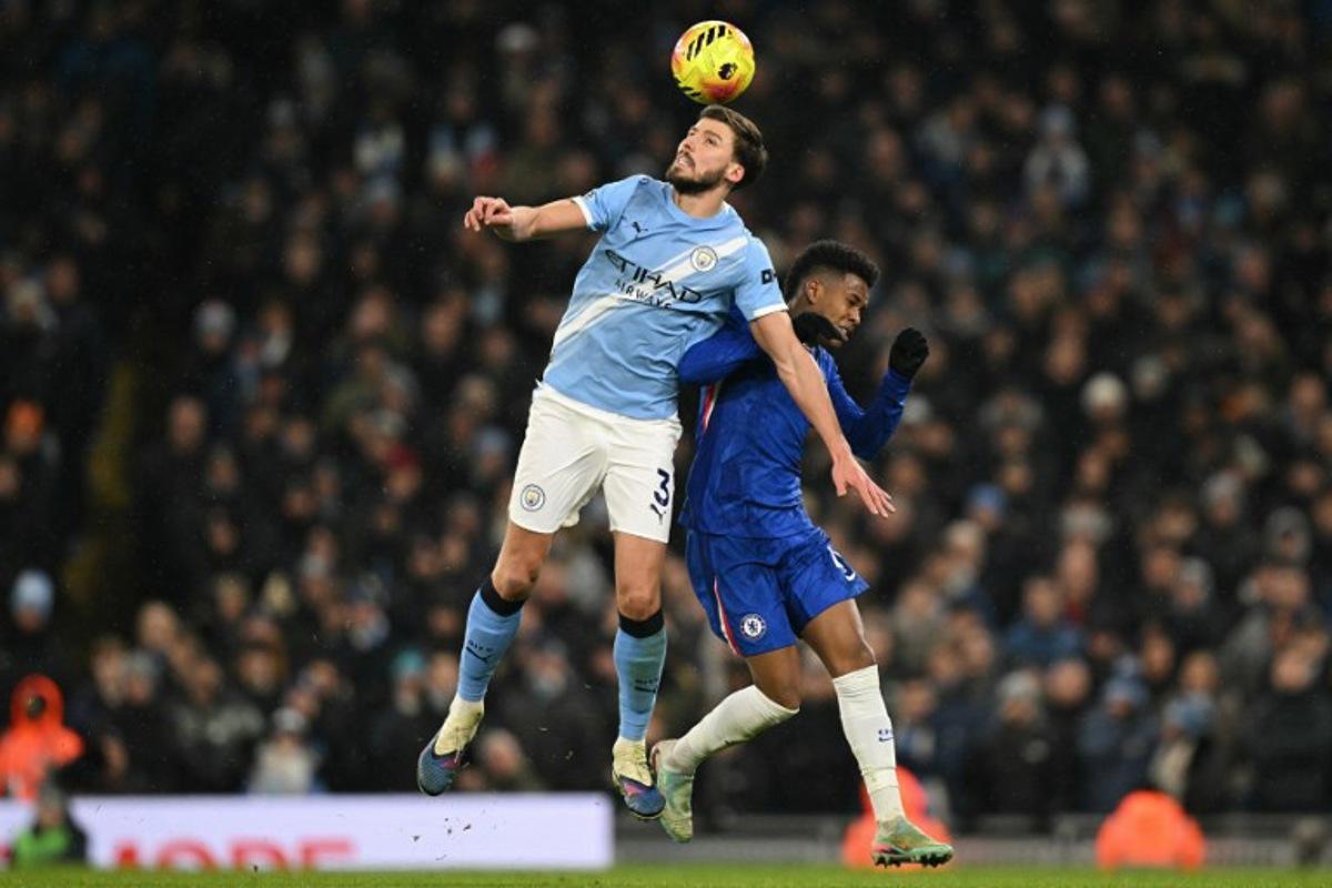 Manchester City's Portuguese defender #03 Ruben Dias (L) vies with Chelsea's Brazilian midfielder #41 Estevao (R) during the English Premier League football match between Manchester City and Chelsea at the Etihad Stadium in Manchester, north west England, on January 4, 2026. Oli SCARFF / AFP