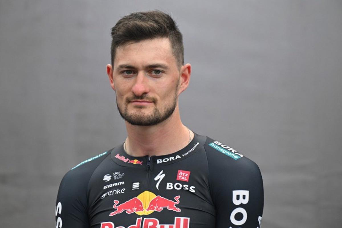 Germany's Nico Denz attends the presentation of the new Red Bull-Bora-Hansgrohe cycling team in Salzburg, Austria, on June 26, 2024. Red Bull on June 26, 2024 unveiled its eight-rider cycling team to debut in this week's Tour de France, marking the energy drink maker's latest expansion of its sports empire. Earlier this year, Red Bull bought a controlling stake in the German Bora-Hansgrohe cycling team. KERSTIN JOENSSON / AFP