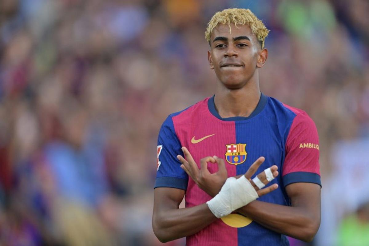 Barcelona's Spanish forward #19 Lamine Yamal celebrates scoring an equalizing goal during the Spanish league football match between FC Barcelona and Villarreal CF at Estadi Olimpic Lluis Companys in Barcelona on May 18, 2025. MANAURE QUINTERO / AFP