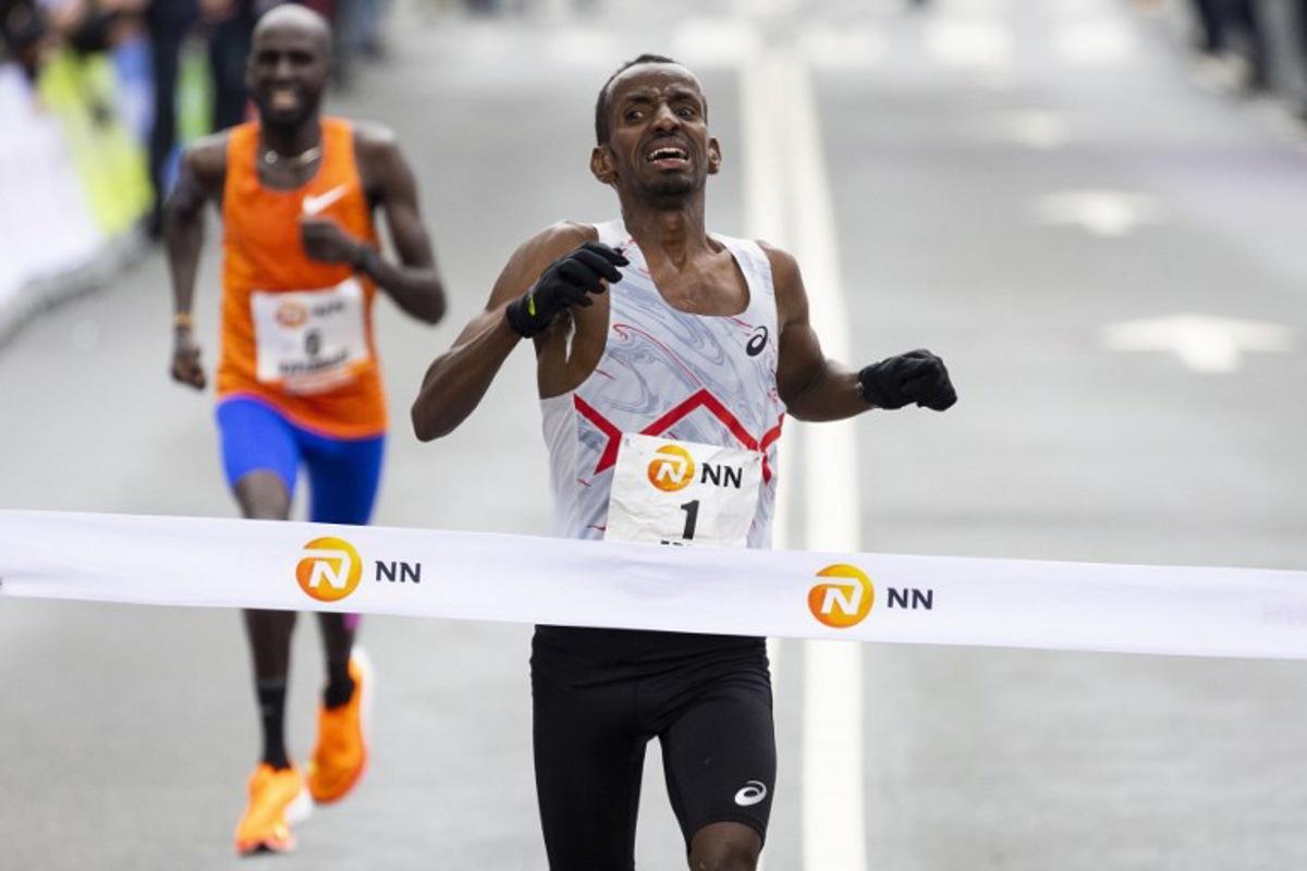 Bashir Abdi from Belgium crosses the finish line to win the Rotterdam Marathon in Rotterdam, on April 16, 2023. Sem van der Wal / ANP / AFP