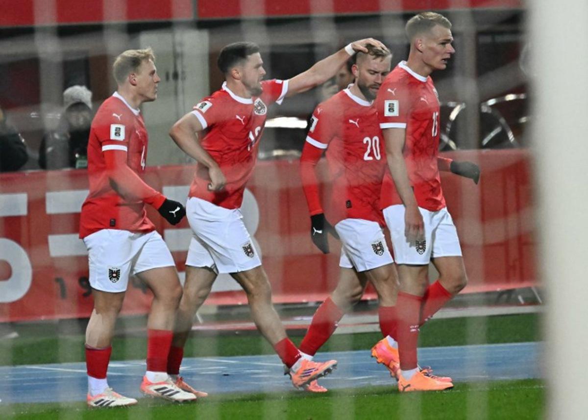 Austria's midfielder #20 Konrad Laimer (2R) celebrates with teammates scoring his team's first goal that was disallowed after during the FIFA World Cup 2026 European qualification Group H football match between Austria and Bosnia and Herzegovina, in Vienna on November 18, 2025. Joe Klamar / AFP