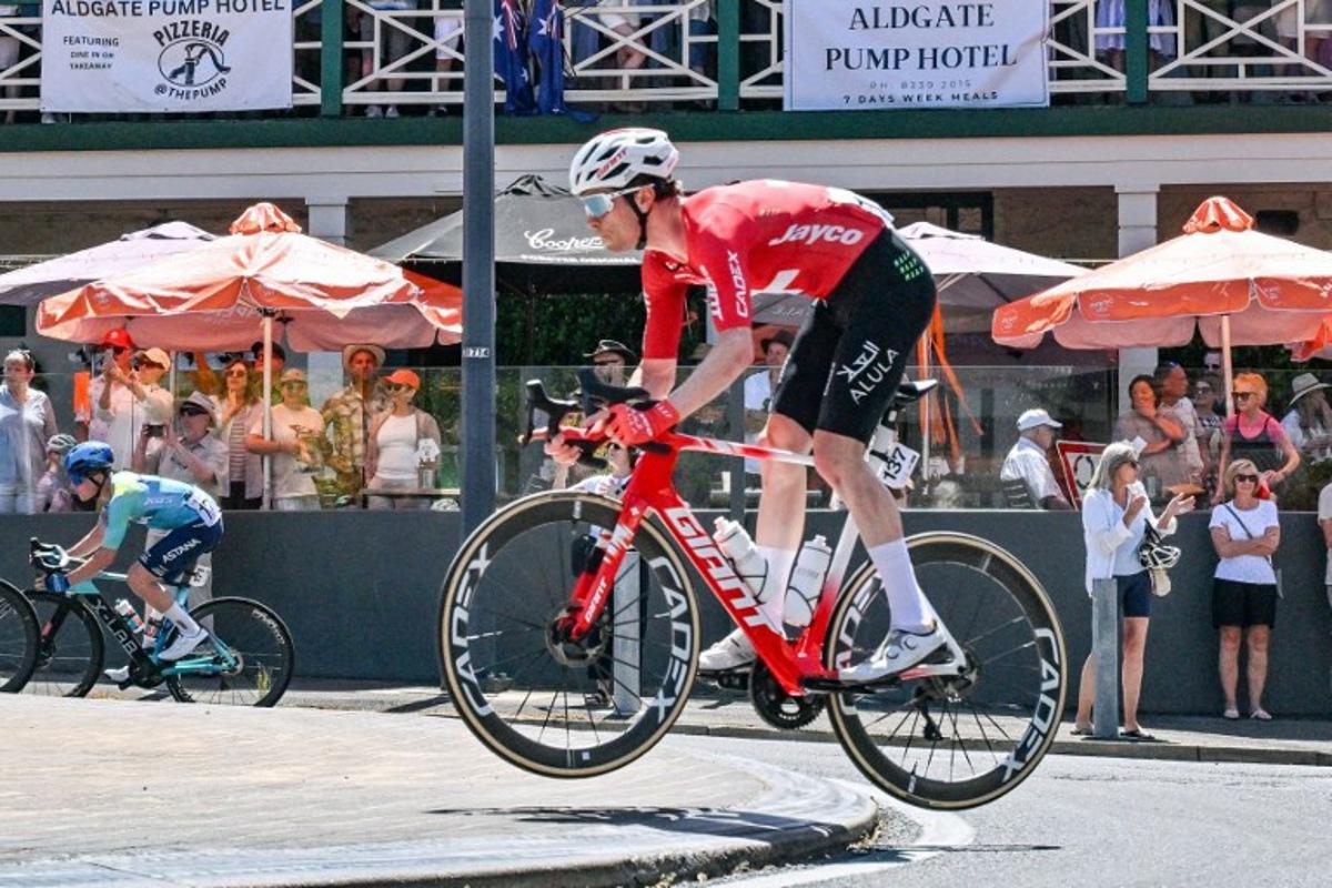 Jayco AlUla rider Mauro Schmid from Switzerland jumps over a kerb in Aldgate during stage five of the Tour Down Under UCI Men's Cycling in Adelaide on January 25, 2026. Brenton Edwards / AFP
