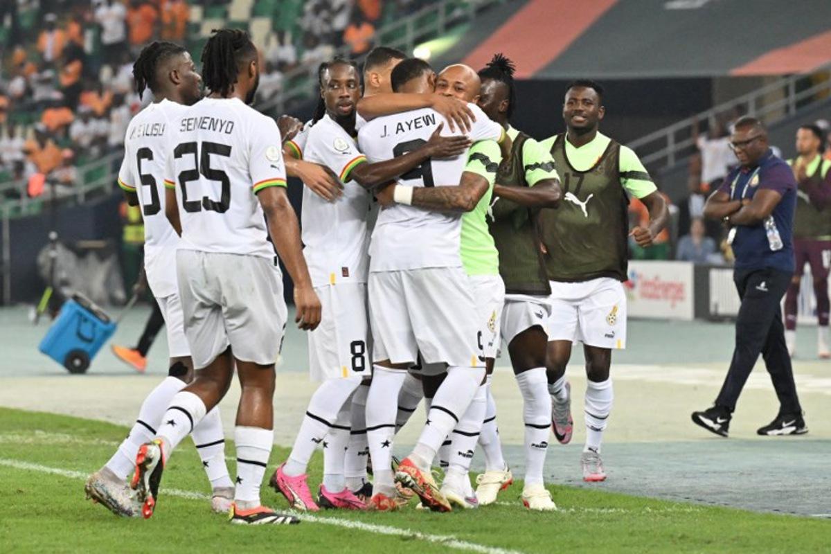 Ghana's forward #9 Jordan Ayew celebrates with teammates after scoring his team's first goal during the Africa Cup of Nations (CAN) 2024 group B football match between Mozambique and Ghana at Alassane Ouattara Olympic Stadium in Ebimpe, Abidjan on January 22, 2024. Issouf SANOGO / AFP